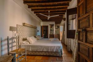Ένα ή περισσότερα κρεβάτια σε δωμάτιο στο Casa del Aljibe