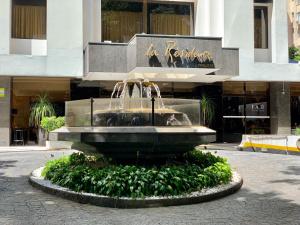 a water fountain in front of a building at 415 - Rentaqui - Flat Jardins Residence Confort in Sao Paulo