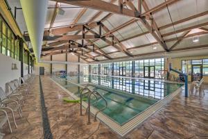 a swimming pool in a large building with a swimming pool at Cozy-Chic Escape Private Deck and Resort Perks in Galena