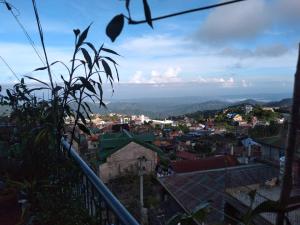 a view of a city from a hill at ARSIAM Transient Room in Baguio