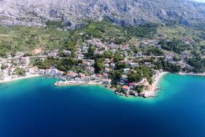 an aerial view of a small island in the water at Apartments by the sea Mimice, Omis - 656 in Mimice