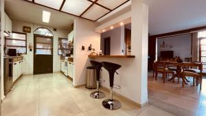 a kitchen and dining room with a table and chairs at Blue Sky Mendoza in Mendoza