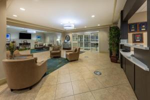 a lobby of a hospital with chairs and a waiting room at Candlewood Suites Springfield South, an IHG Hotel in Springfield