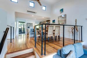 a staircase in a house with a blue couch at Shorelines in Hamilton Island