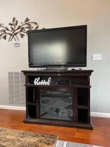 a flat screen tv sitting on top of a fireplace at Penthouse suite at Holiday Hills Book today in Branson