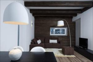 a living room with a couch and a table at House Neza in Kranjska Gora