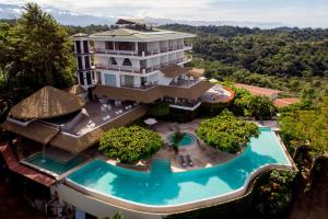 an aerial view of a resort with a swimming pool at Hotel La Mariposa in Manuel Antonio