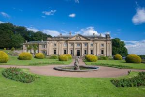 a large house with a fountain in front of it at Wortley Hall Sheffield in Sheffield