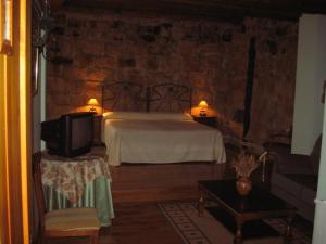 Cama o camas de una habitación en Posada Los Vallucos