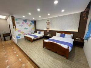 Letto o letti in una camera di Zi Jìng Fang Inn