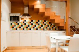 Una cocina o zona de cocina en Apartamentos María Luisa