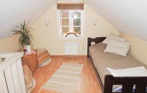 a living room with a couch and a window at Nice Home In Halmstad With Kitchen in Öppinge