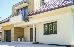 a rendering of a house with a balcony at Nice Apartment In Grzybowo With Kitchenette in Grzybowo