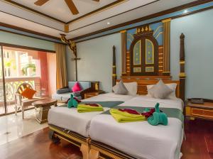 Postel nebo postele na pokoji v ubytování Ayodhaya Palace Beach Resort - SHA Plus certified