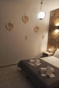 Кровать или кровати в номере Alexander Apartments Nea Koutali