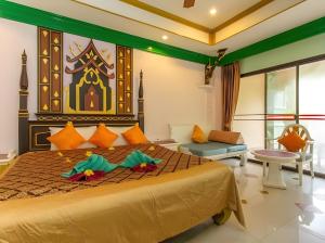 Postel nebo postele na pokoji v ubytování Ayodhaya Palace Beach Resort - SHA Plus certified
