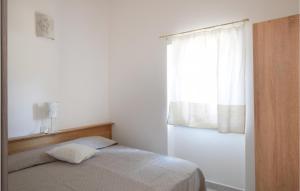 Postel nebo postele na pokoji v ubytování Awesome Home In Olbia With Wifi And 2 Bedrooms