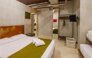 Posteľ alebo postele v izbe v ubytovaní Cozy Apartment In Porto Santelpidio + 11 fotografií
