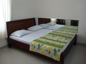 Postel nebo postele na pokoji v ubytování Quốc Ân Motel
