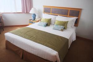 A bed or beds in a room at The Kimberley Hotel
