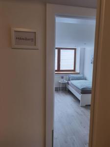 Postel nebo postele na pokoji v ubytování Main Appartement-Haus - 97896 Freudenberg