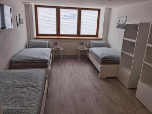 Postel nebo postele na pokoji v ubytování Main Appartement-Haus - 97896 Freudenberg