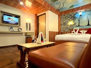 a hotel room with two beds and a tv at Thamel Seasons Hotel in Kathmandu