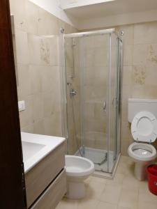 a bathroom with a shower and a toilet and a sink at App Angela - Ponale 3 in Riva del Garda