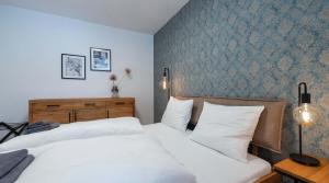 Łóżko lub łóżka w pokoju w obiekcie Apartment am Grundlsee
