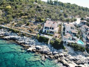 an aerial view of a house next to the water at Apartment Tranquillo in Vela Luka