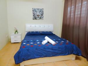 Letto o letti in una camera di Dream Borneo Budget Homestay Kota Kinabalu