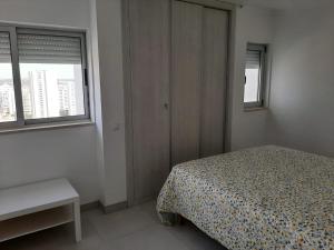 a bedroom with a bed and a window at Vue Ocean in Portimão +17 photos