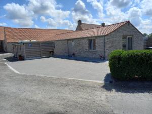 a brick house with a large driveway in front of it at de blinker in Knokke-Heist