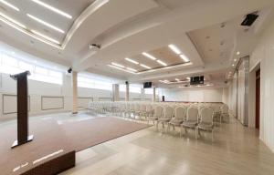 a large room with a bunch of chairs in it at MPM Sport HOTEL in Radomsko