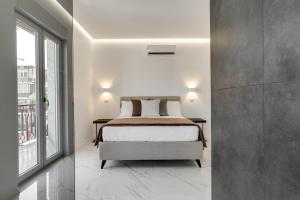 Krevet ili kreveti u jedinici u okviru objekta Caralis Suites Rooms