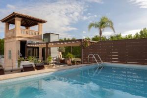 a swimming pool with a fence around a house at Hotel Can Alomar in Palma de Mallorca