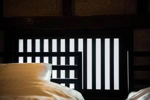 Letto o letti in una camera di Oito 美しい街並みに佇む喫茶と宿
