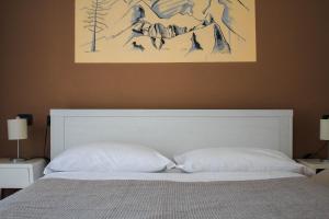 Postel nebo postele na pokoji v ubytování Hotel Fontaine Bleue