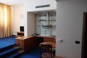 an office with a desk and a chair in a room at Hotel Brass in Sarajevo