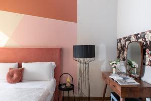 Un ou plusieurs lits dans un hébergement de l'établissement Boutique Hotel Galatea