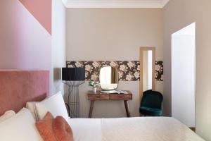 Un ou plusieurs lits dans un hébergement de l'établissement Boutique Hotel Galatea