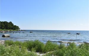 a large body of water with rocks in it at 2 Bedroom Amazing Home In Fjälkinge in Fjälkinge +13 photos