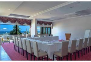 a large room with a long table and chairs at Westport Istanbul Resort & Spa Hotel in Silivri