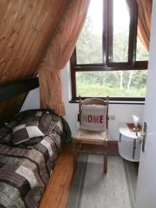 Ένα ή περισσότερα κρεβάτια σε δωμάτιο στο Ferienhaus Dünenröschen