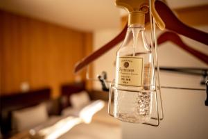 a bottle of water is hanging from a light fixture at Hotel Ekichika Nagahoribashi in Osaka