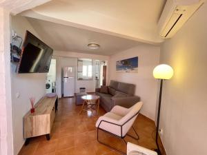 Televízia a/alebo spoločenská miestnosť v ubytovaní Gerona Center Apartment