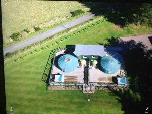 an overhead view of a house with two domes at Green Yurt with Hot Tub - Sleeps 3 Parking & WiFi in Turriff