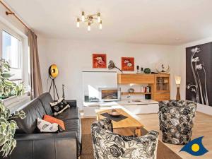 a living room with a couch and a table at Haus Meeresrauschen Whg 03 in Bansin