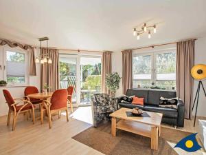 a living room with a couch and a table at Haus Meeresrauschen Whg 03 in Bansin