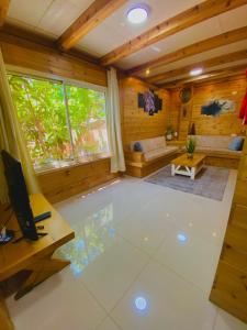 a large living room with a television and a couch at toptop1 in Majdal Shams